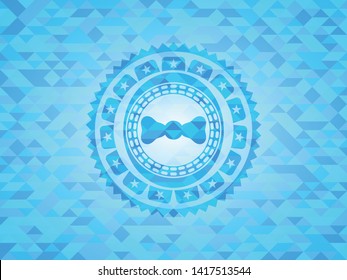 bow tie icon inside light blue mosaic emblem