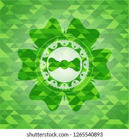 bow tie icon inside realistic green emblem. Mosaic background