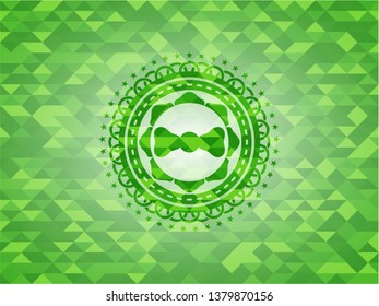 bow tie icon inside realistic green emblem. Mosaic background