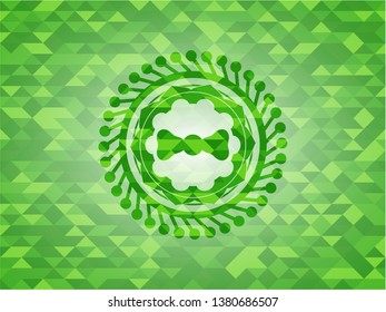 bow tie icon inside realistic green mosaic emblem