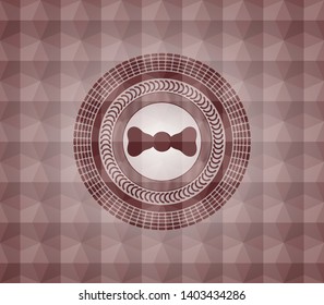 bow tie icon inside red seamless badge with geometric pattern.