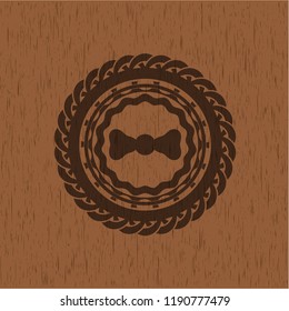 bow tie icon inside retro style wood emblem
