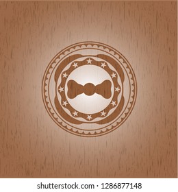 bow tie icon inside retro style wood emblem