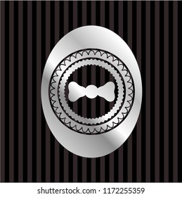 bow tie icon inside silver shiny emblem