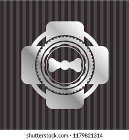 bow tie icon inside silvery shiny badge