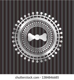 bow tie icon inside silvery badge or emblem