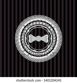 bow tie icon inside silvery badge or emblem