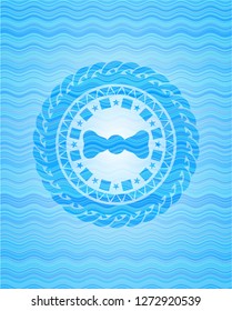 bow tie icon inside water wave representation emblem background.