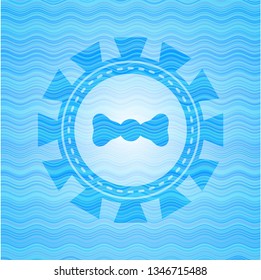 bow tie icon inside water wave concept emblem background.