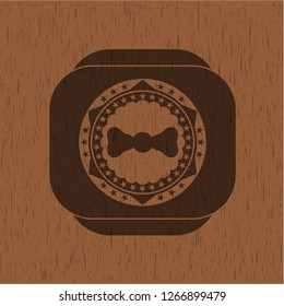 bow tie icon inside wooden emblem