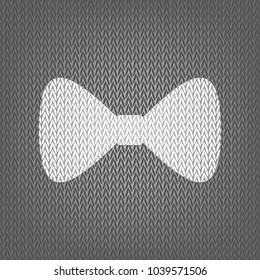 Bow Tie icon. Vector. White knitted icon on gray knitted background. Isolated.