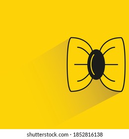 bow tie with shadow on yellow background