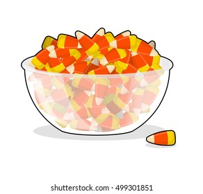 Bowl and candy corn. Sweets on plate. Traditional Treats for Halloween
