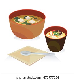 A bowl of miso soup and a bowl of mole egg with spoon and tissues.