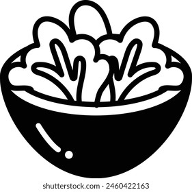 A bowl of salad with a few pieces of broccoli and a carrot. The bowl is black and white