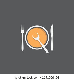 bowl of soup with spoon, fork and knife isolated on black background