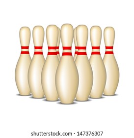 Bowling pins with red stripes standing in formation