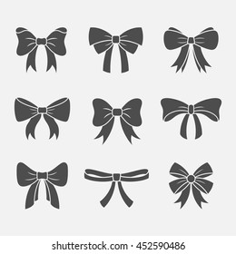 Bows with ribbons vector set isolated from the background. Dark silhouettes of decorative gift or holidays bows and knots. 