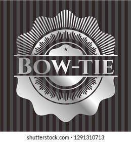 Bow-tie silvery badge or emblem