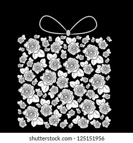 box is decorated by flowers and bow on a black background