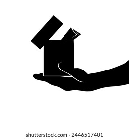 Box with donation in the palm of man hand. Black silhouette of a hand with a box.