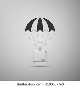 Box flying on parachute icon isolated on grey background. Parcel with parachute for shipping. Delivery service, air shipping concept, bonus concept. Flat design. Vector Illustration