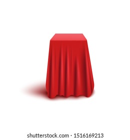 Box or stand covered with red satin cloth, fabric 3d realistic vector illustration isolated on white background. Secret gift, present or surprise hiding cover.