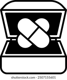 A box with two pills inside. The box is black and white