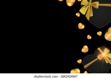 Cajas con un arco dorado y formas doradas de corazones sobre un fondo negro. Opción de diseño para una postal para el cumpleaños y el día de San Valentín