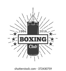 Boxing club and martial arts logo badge/label in vintage style with lighting rays and punching bag. Vector illustration. Sport sign