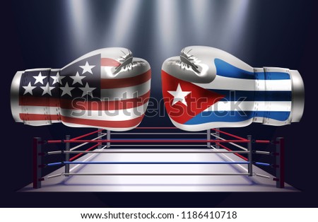 Boxing gloves with prints of the USA and Cuba flags facing each other on a ring lit by spotlights, realistic vector illustration design