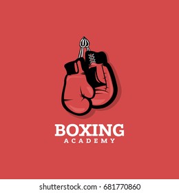 Boxing logo concept on red background with hanging boxing gloves. Vintage style.