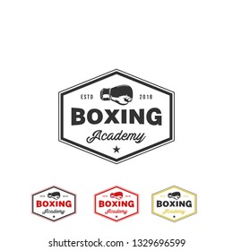 Boxing and martial arts logo, badge or label in vintage style. Vector illustration 