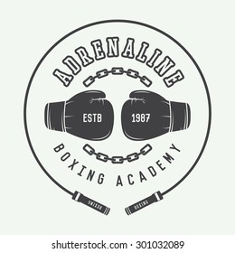 Boxing and martial arts logo, badge or label in vintage style. Vector illustration