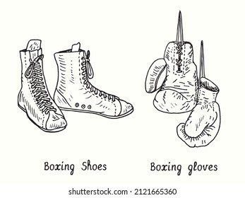 Boxing shoes and gloves. Ink black and white doodle drawing in woodcut style.