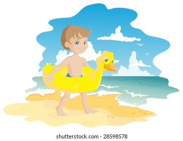 Boy and air-duck on beach