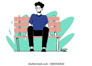 Boy alone sitting on bench