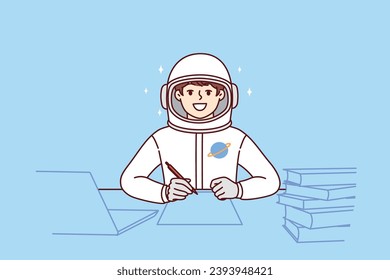 Boy astronaut does homework sitting at table with books, dressed in spacesuit for flight into space. Child dreams of becoming astronaut and participating in shuttle mission exploring universe.