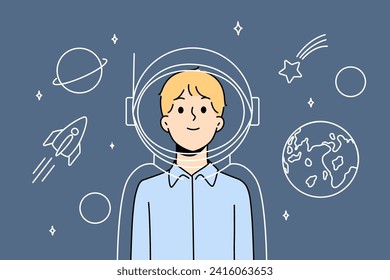 Boy astronaut in imaginary suit and spacesuit for space flights stands among stars and planets of solar system. Child dreams of becoming astronaut and participating in research mission on earth