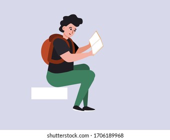  Un niño con mochila lee un libro