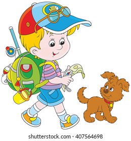Boy backpacker walking with his dog