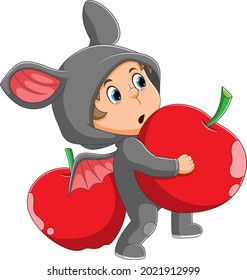 The boy with the bat costume is holding the apple of illustration
