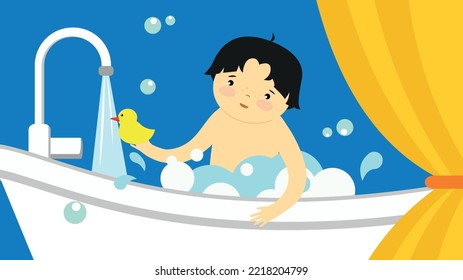 Boy bathes in a tub with a rubber duck