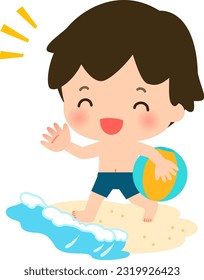 Boy with beach ball playing on the beach