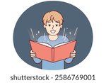 Boy before adolescence with open book in hands reads fairy tale or comics with interest. Student fulfills instructions teacher and is engaged in extracurricular activities studying material from book