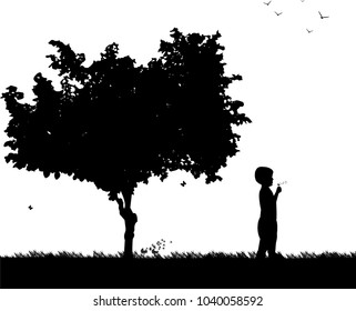 Boy blowing the dandelion in park under the tree silhouette, one in the series of similar images