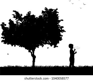 Boy blowing soap bubbles in park in spring silhouette, one in the series of similar images