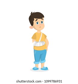 Boy with broken arm standing on white background.