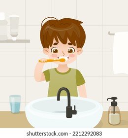 Un niño cepilla los dientes en el baño. Niño de caricatura con cepillo de dientes frente al fregadero.