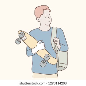 A boy carries a bag and holds a skateboard in his hand. hand drawn style vector design illustrations. 